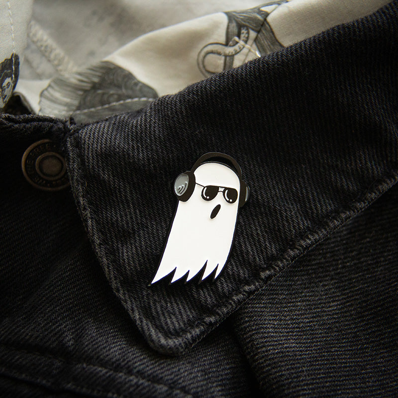 A spooky ghost wearing headphones lapel pin for fans of dark, goth, and alternative music. 