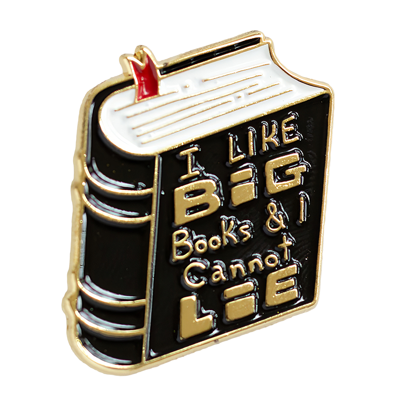 A funny enamel pin of a thick book with the quote, "I Like Big Books and I Cannot Lie".