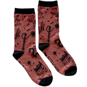 Unisex socks designed by Ectogasm. They feature a tattoo flash pattern with medieval art, including skulls, a flail, swords, gothic architecture, and more. 