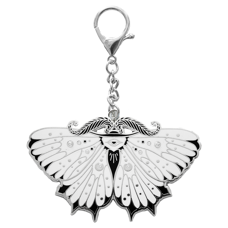 A stylish purse charm of a moth. Made with sterling silver and white moissanite gemstones.
