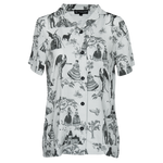 A women's gothic fashion button down shirt with a witchy toile pattern printed on it in light gray and black.