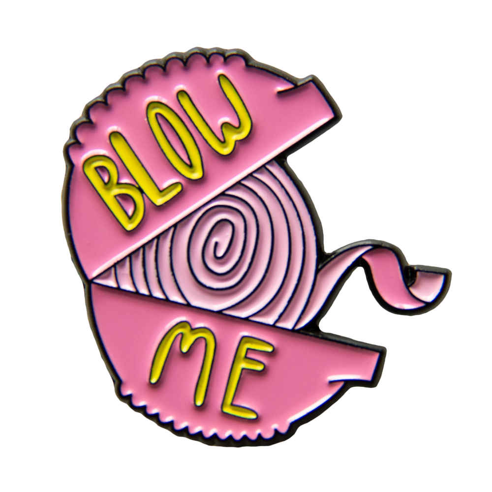 A funny enamel pin of a roll of 90s nostalgic bubble gum with the quote, "blow me". 