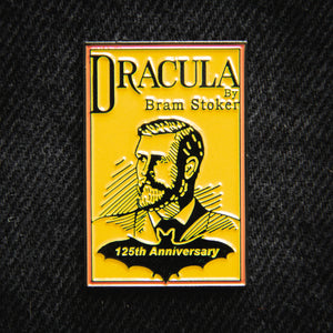 An enamel pin designed for the 125th anniversary of the release of Dracula. Features Dracula's original book cover with a sketch of Bram Stoker. 