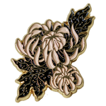 A beautiful black, white, and gold enamel pin of a Chrysanthemum flower, designed by Ectogasm. 
