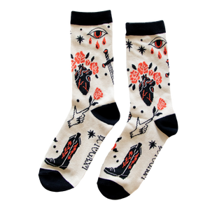 Cool men's and women's socks with a pattern of skulls, snakes, roses, daggers, and more tattoo art.