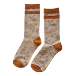 Cute warm toned socks in orange and beige featuring a print of moths and moons. 