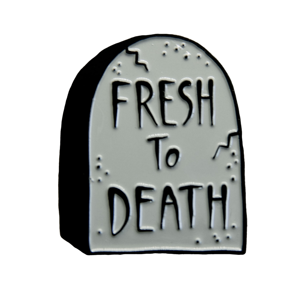 A funny enamel pin of a tombstone with the quote, "Fresh to Death" for alternative fashion. 