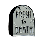 A funny enamel pin of a tombstone with the quote, "Fresh to Death" for alternative fashion. 