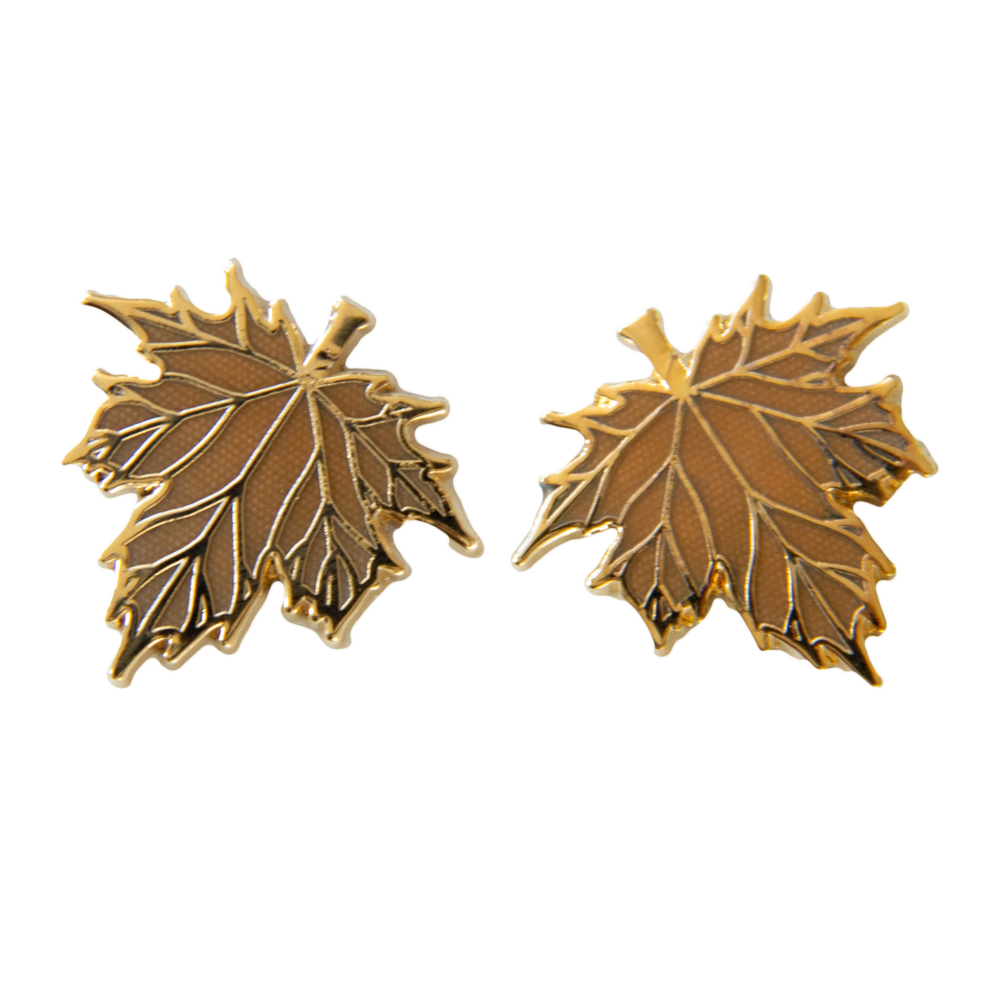 Botanical nature enamel pins of fall leaves that can be worn on the collar and lapels of jackets. 
