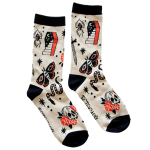 Ectogasm tattoo flash socks in beige, black, and red. 
