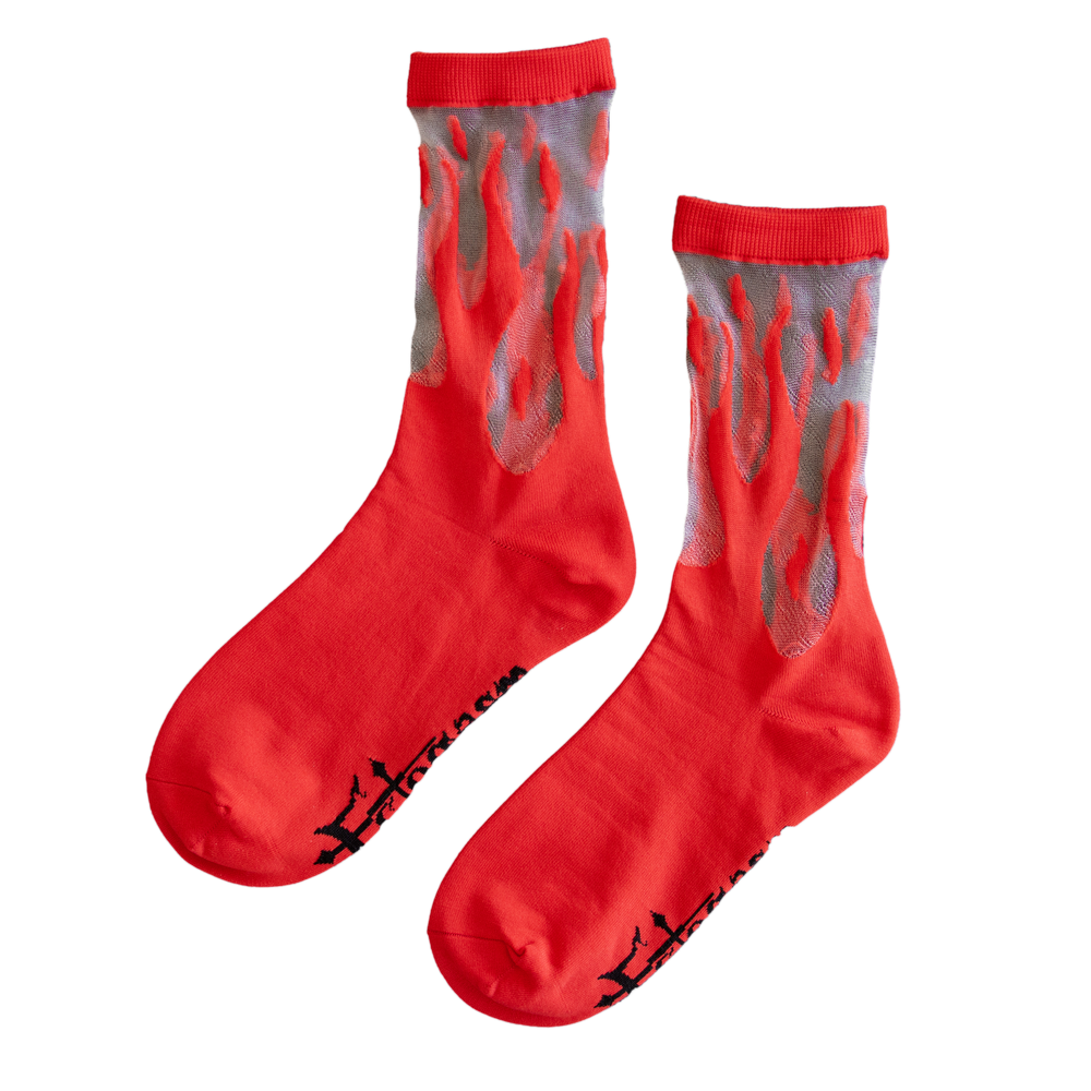 Sheer crew socks with woven red flames for retro 90s inspired fashion. 