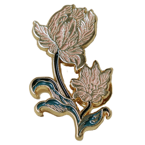 A beautiful enamel pin of a tulip, inspired by vintage botanical illustrations. 