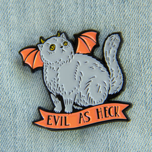 A cute Halloween enamel pin of a devil cat with horns and batwings. It has the funny quote on it, "Evil as Heck". 