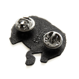 metal clasps on the back of an Ectogasm lapel pin. 