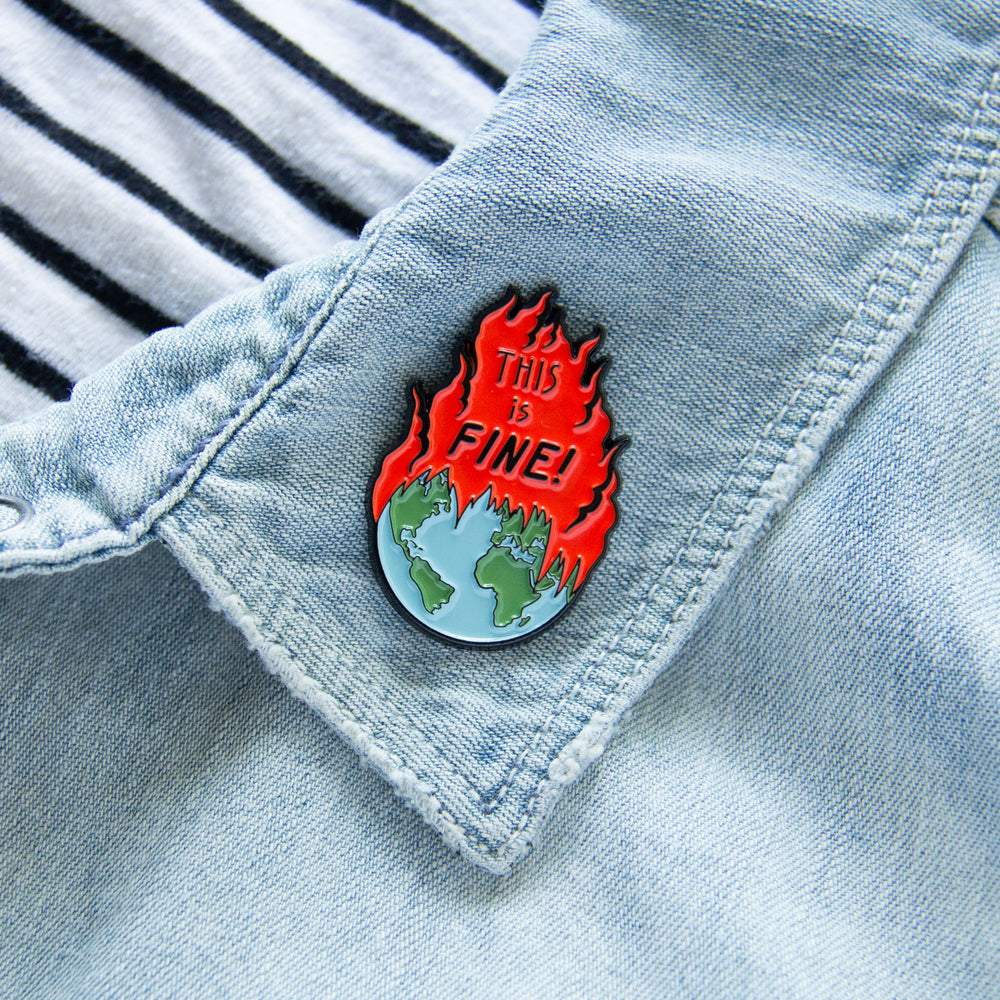 A funny political enamel pin about global warming. 