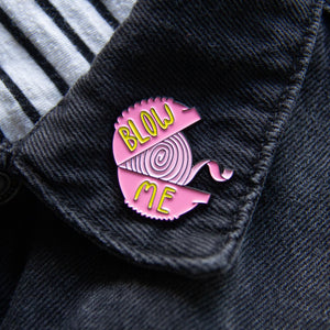 A snarky lapel pin for men and women of bubble gum with the quote, "blow me". 