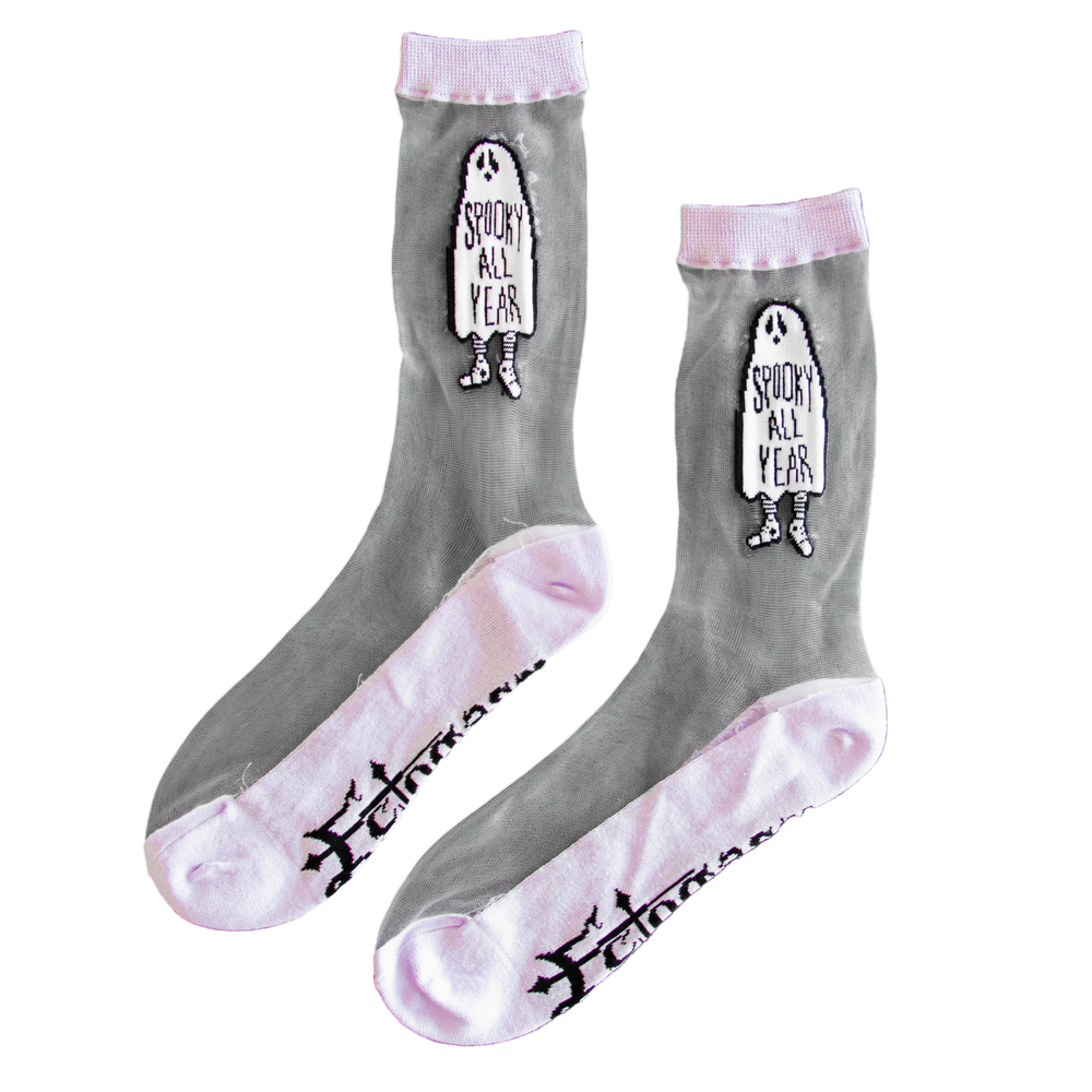 Sheer socks with a ghost on them and the funny quote, "Spooky All Year". Socks are black and white with pastel purple details. Made by designer Ectogasm.