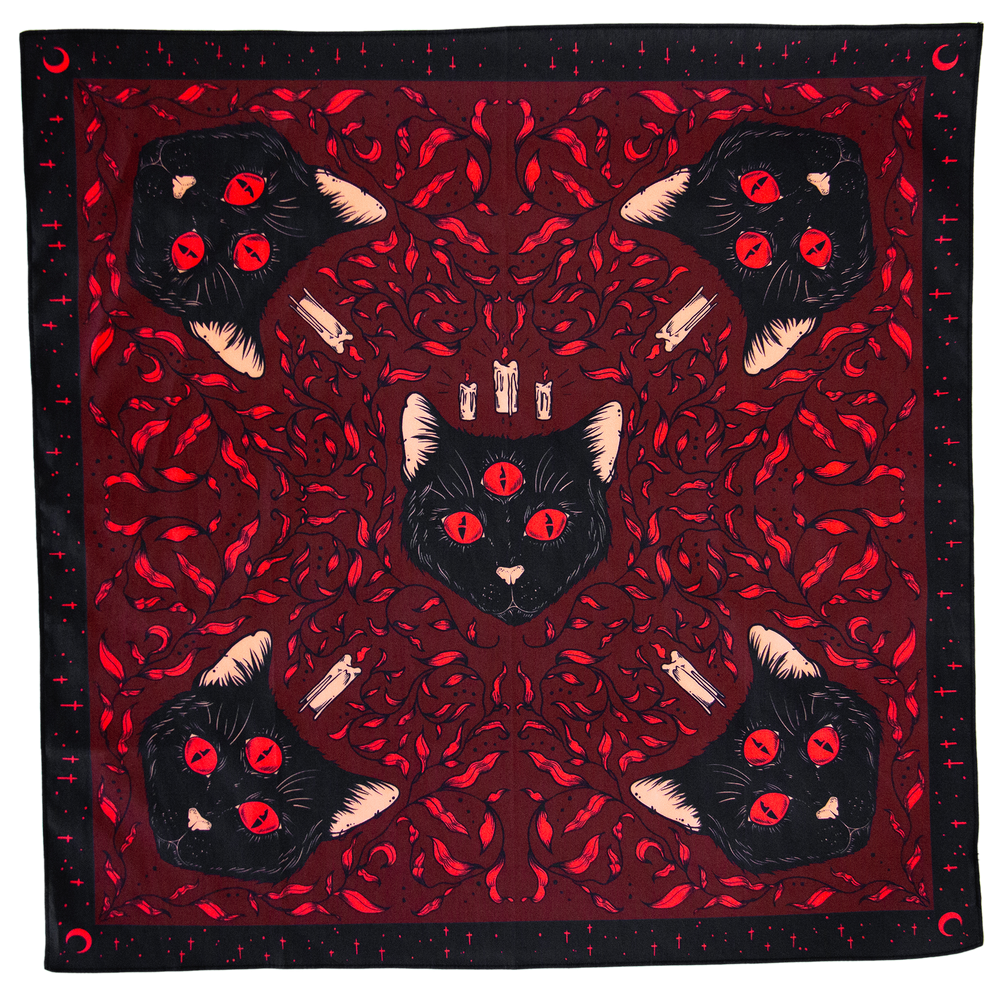 A black and red occult art wall hanging with black cats, medieval nature imagery, and candles. 