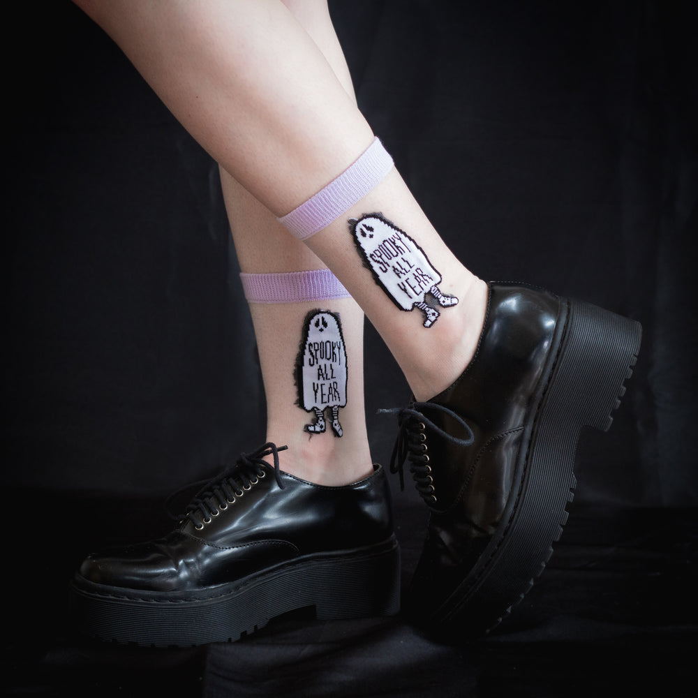 Transparent "Spooky All Year" ghost socks worn with women's black platform creepers for alternative and goth fashion. Designed by Ectogasm.
