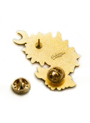 Metal clasps on the back of an Ectogasm lapel pin for women's style. 