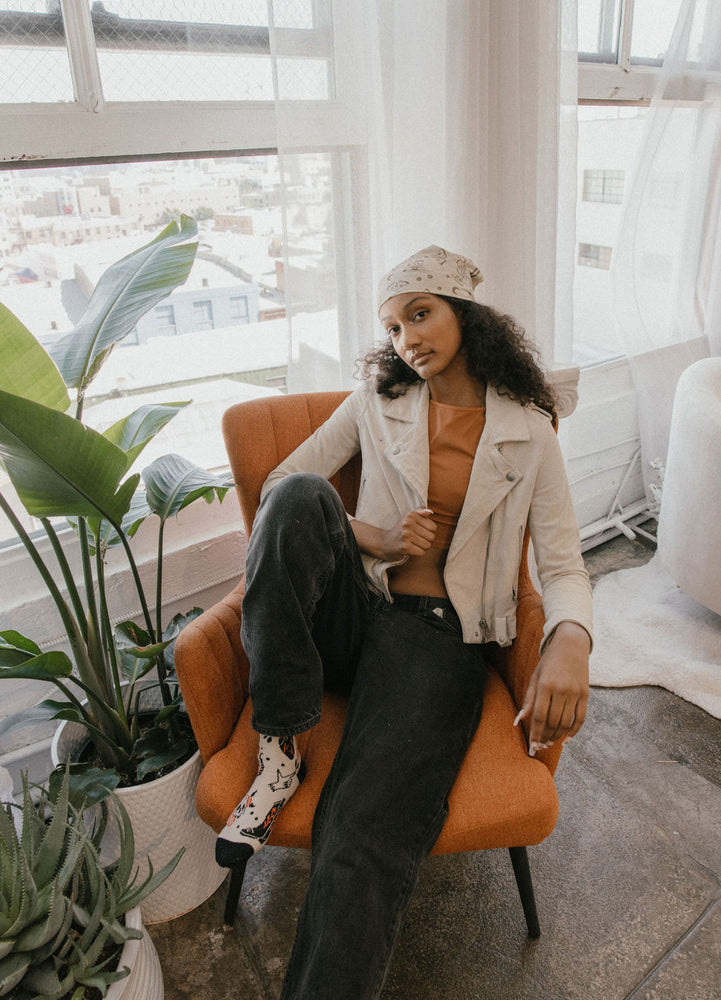 A stylish woman wearing a bandana for casual women's fashion. 