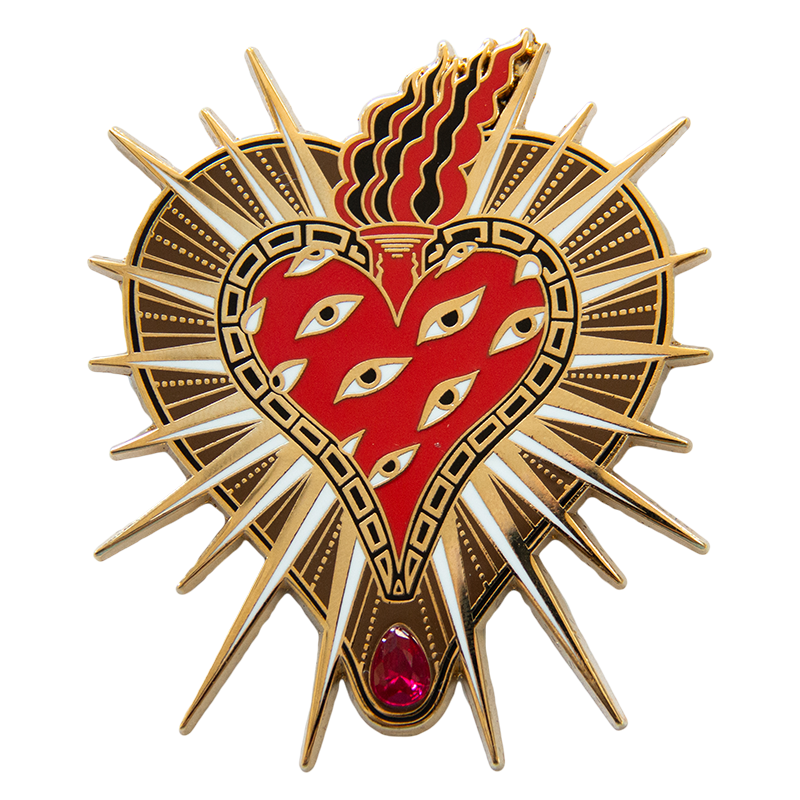 A large 18k gold plated enamel pin brooch of a sacred heart with eyes in tattoo style for punk fashion.