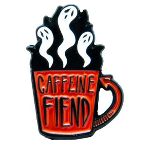 A funny enamel pin of a coffee cup with ghosts. 