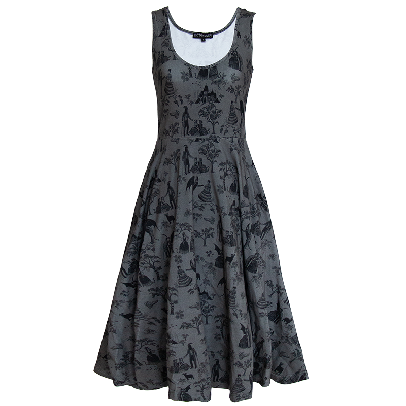 A women's goth fashion midi dress with a witchy print on the fabric in black and gray. 