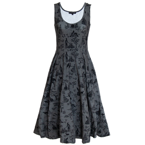 A women's goth fashion midi dress with a witchy print on the fabric in black and gray. 