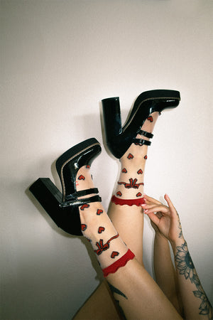 Sheer socks with red hearts for women's alternative fashion.