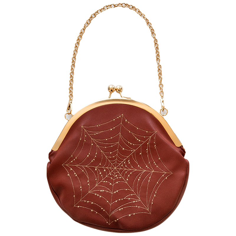 Brown handbag with spider web design and gold chain handle for vintage fall fashion. 