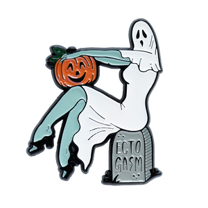 A spooky enamel pin of a vintage pinup ghost woman holding a pumpkin. 