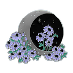 A witch aesthetic enamel pin of a crescent moon with night sky, stars, and purple flowers. 