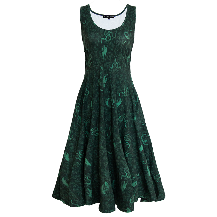 A green fit and flare dress with a witch aesthetic snake and botanical print. 