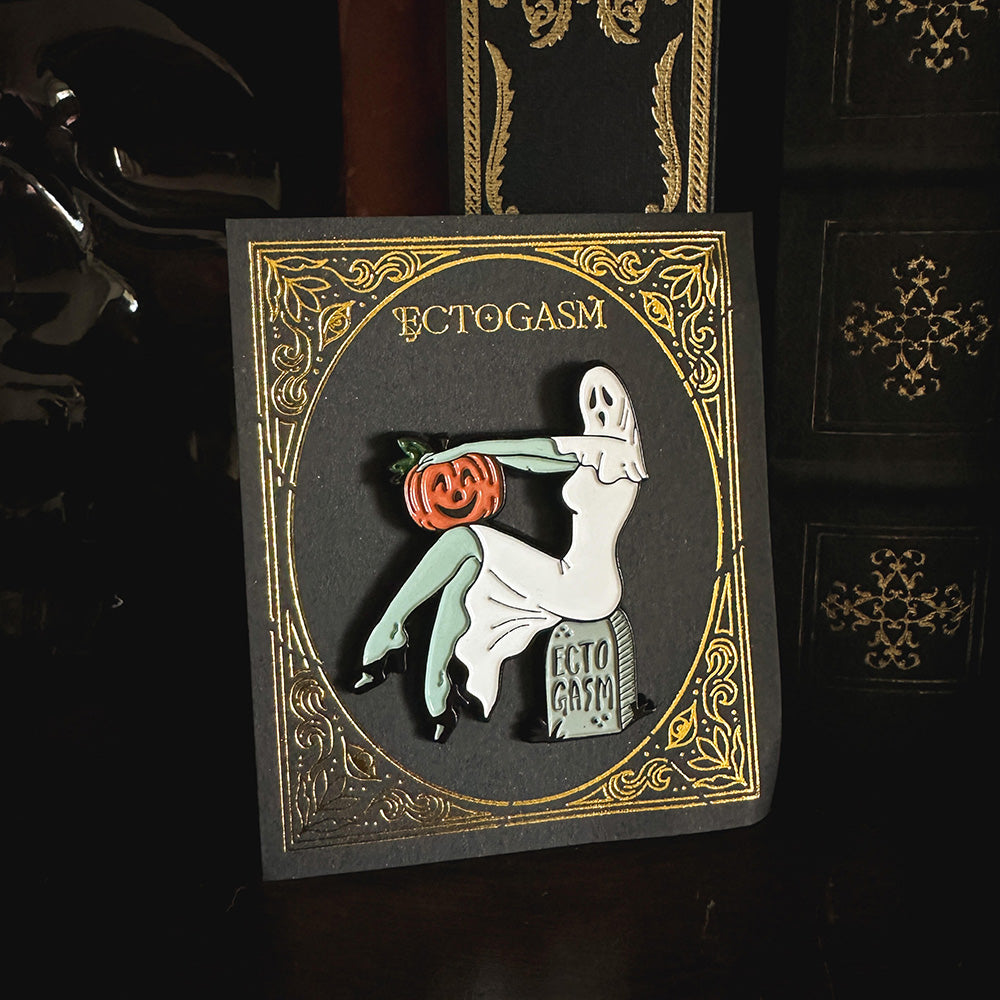 A spooky Halloween ghost enamel pin for gothabilly and rockabilly style. 