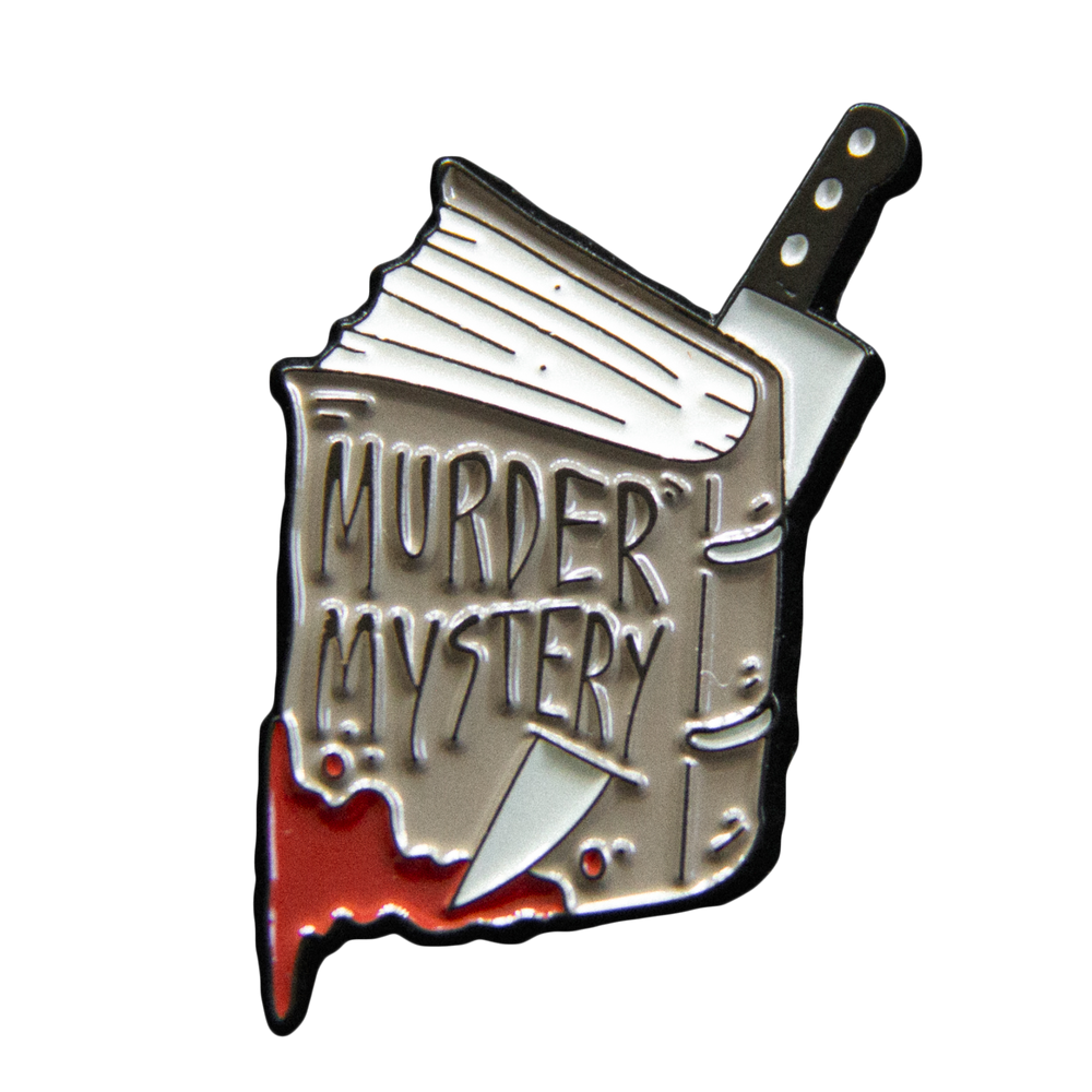 Book Enamel pin with 'Murder Mystery' text and knife design.