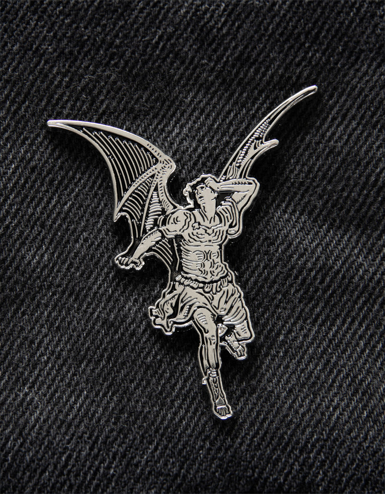 A cool enamel pin for punk, goth, and rock and roll fashion featuring lucifer in black and silver. 