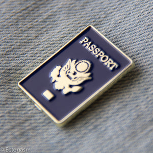Passport pin, designed by Ectogasm. Made in shiny gold and blue. 