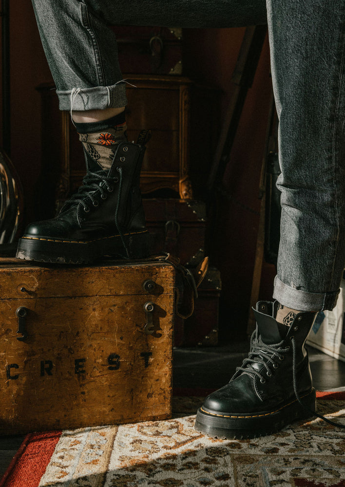 Mushroom sock worn with combat boots for cool fashion.