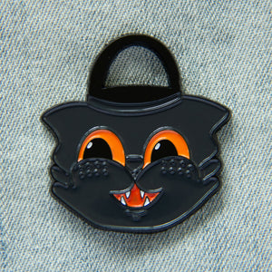 A cute enamel pin of a vintage style halloween trick or treat bucket. 
