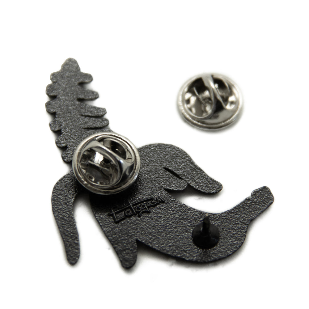 Metal clasps on the back of a punk fashion lapel pin.