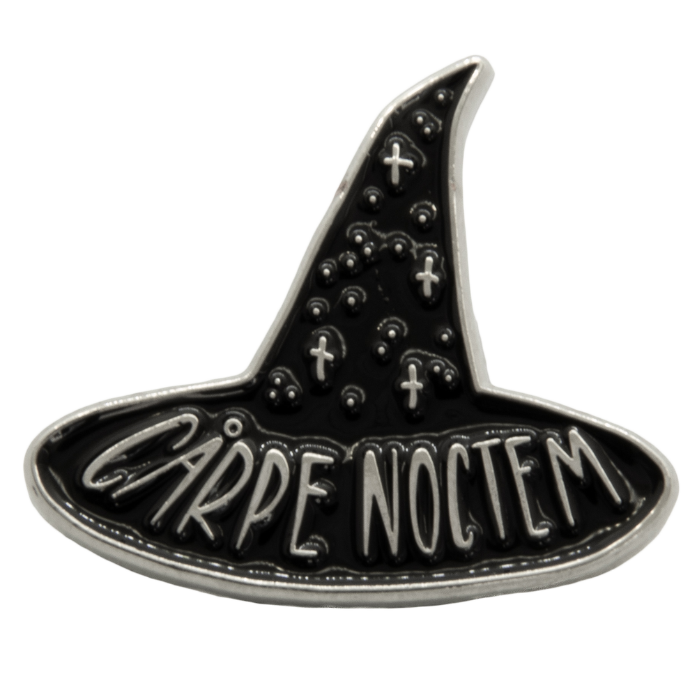 A black and silver lapel pin of the quote, "Carpe Noctem" for spooky goth fashion. Designed by artist Ectogasm. 