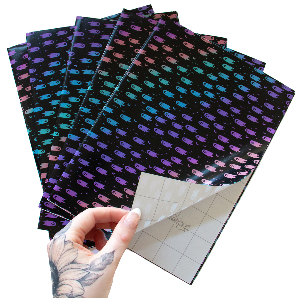 5 sheets of Ectogasm creepy cute rainbow gift wrap for birthdays and Christmas.