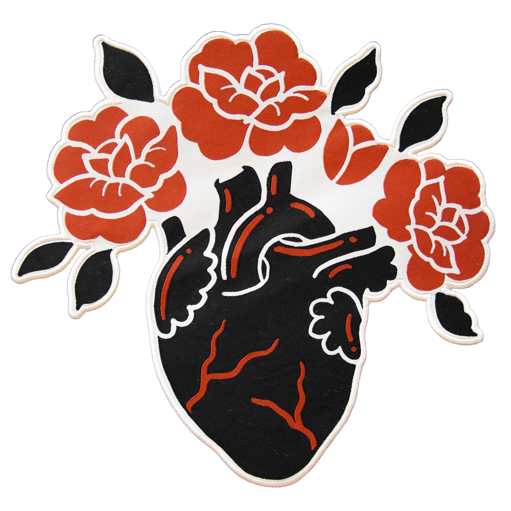 A cool black, red, and white back patch of an anatomical heart blooming with roses. 