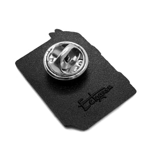 A metal clasp on the back of an ectogasm lapel pin. 