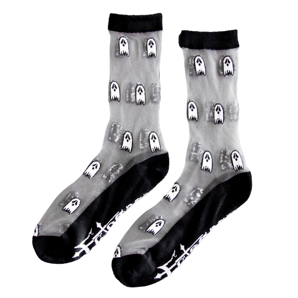 Sheer black and white socks printed with cute, tiny ghosts for Halloween fashion. Designed by Ectogasm. 