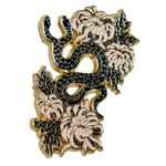 A cool enamel pin of a two headed snake with chrysanthemum flowers for women's dark, edgy fashion and yallternative style. 