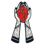 Ectogasm enamel pin gift of hands holding an anatomical heart. 