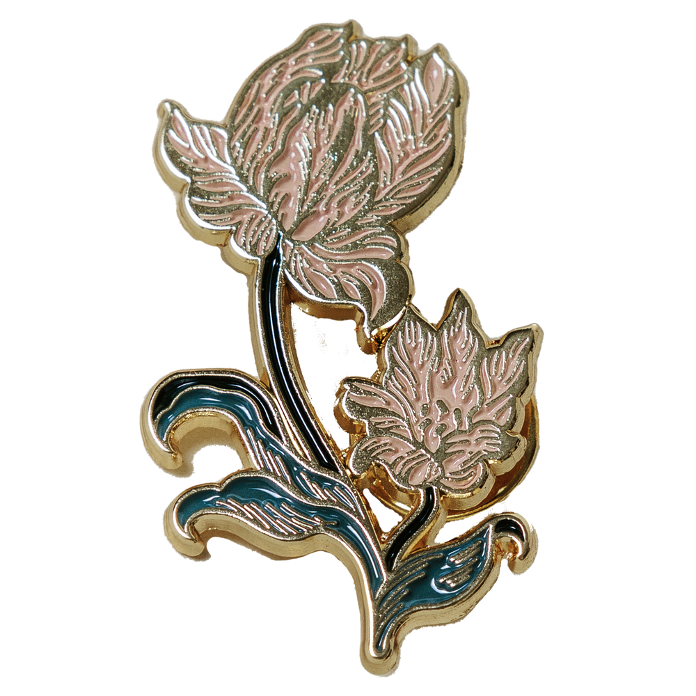 A beautiful enamel pin of a tulip, inspired by vintage botanical illustrations. 