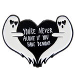 A funny dark humor enamel pin of two ghosts with a black heart and the quote, "You're Never Alone If You Have Demons"